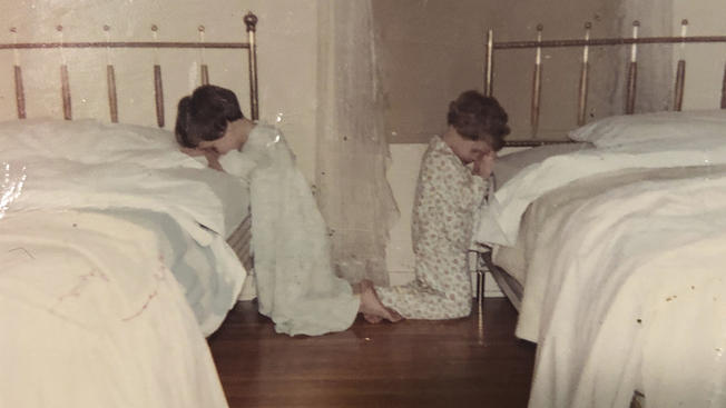 This October 1968 family photo shows Katie Bowman as a child, right, in her room in Waterloo, Iowa. Bowman’s parents welcomed into their religious home three priests who molested her, she said, starting when she was around 4, a few months after this photo was taken.