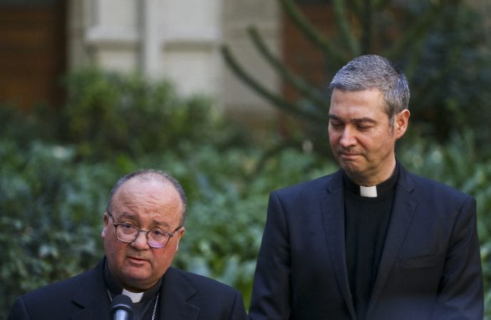 Archbishop Charles Scicluna, left, and Spanish Monsignor Jordi Bertomeu, right, take part in a press conference at the Catholic University of Chile, in Santiago, Chile, Wednesday, June 13, 2018. (Credit: AP Photo/Esteban Felix.)