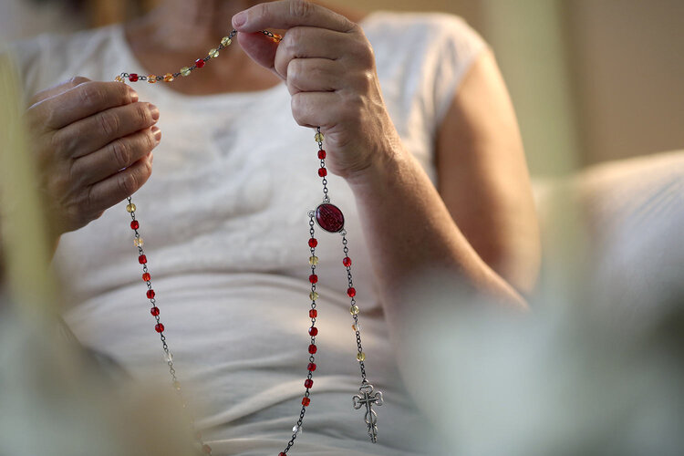 Dorothy Small, prays the rosary in her home in Woodland, Calif., on Tuesday, Sept. 24, 2019. She prays in her home often, sometimes multiple times a day. (AP Photo/Wong Maye-E)