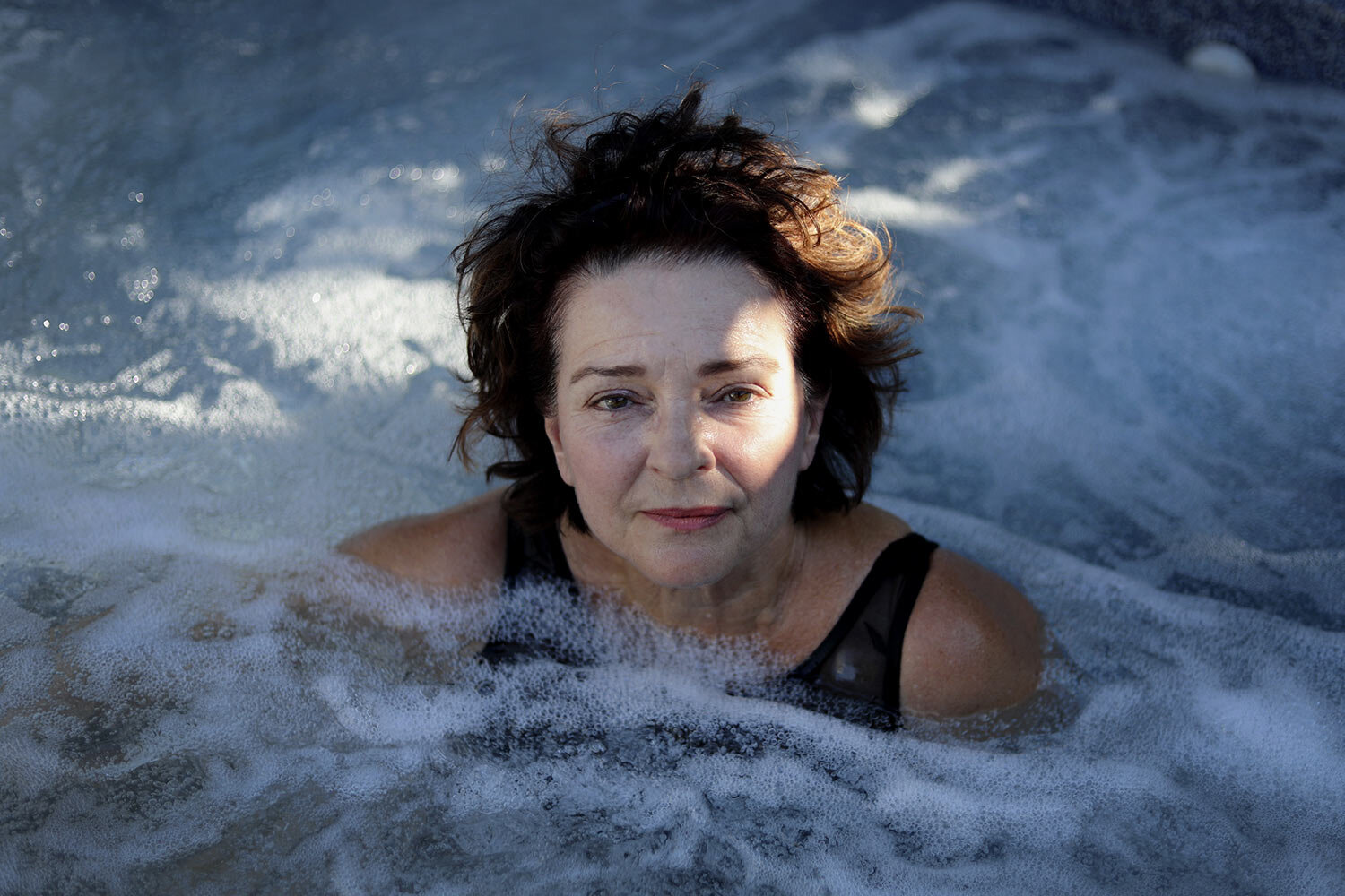 Dorothy Small, poses for a portrait in her hot tub in the backyard of her home in Woodland, Calif., on Tuesday, Sept. 24, 2019. Small often slips into the warm water and prays, part of a ritual that has helped her embrace a private religious practice. (AP Photo/Wong Maye-E)