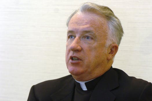 This Feb. 21, 2005, file photo, shows bishop of the Wheeling-Charleston diocese, W.Va, Michael Bransfield in his office, in Wheeling, W.Va.