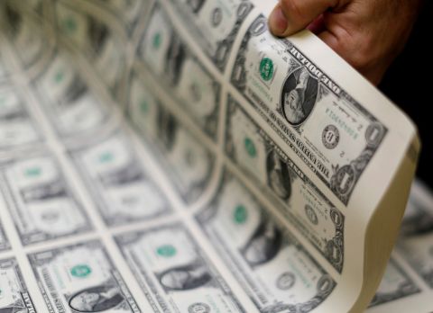 In this 2014 file photo, U.S. dollar bills are seen at the Bureau of Engraving and Printing in Washington. A bankruptcy judge in Minnesota approved the Diocese of New Ulm's clergy sexual abuse settlement March 10. (CNS/Reuters/Gary Cameron)