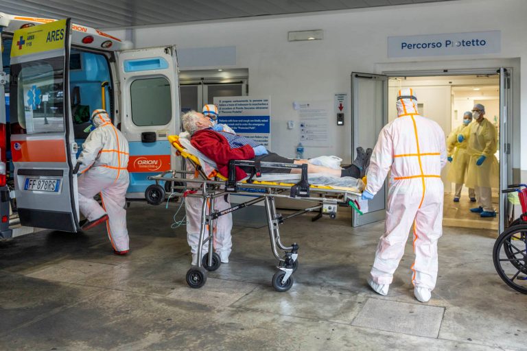 Medical workers at Gemelli Hospital in Rome wear protective suits as they attend an elderly coronavirus patient March 16, 2020. Pope Francis urged Christians March 17 to remember the elderly who are suffering not only loneliness but also fear due to the spread of the coronavirus. (CNS photo/Policlinico Gemelli, handout via Reuters)