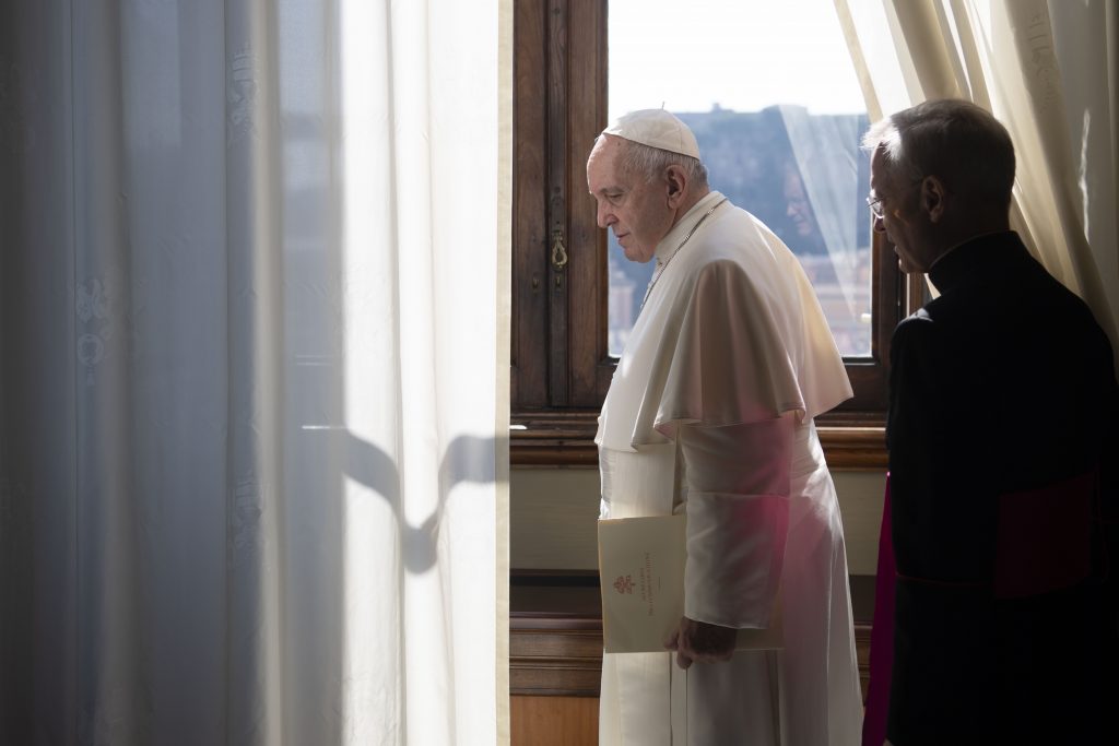 Pope Francis leaves the library of the Apostolic Palace at the Vatican March 18 after a livestream of his weekly general audience. (Catholic News Service/Vatican Media)