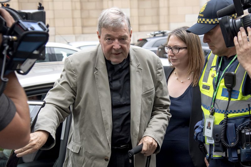 In this Feb. 26, 2019, photo, Cardinal George Pell leaves the County Court in Melbourne, Australia. Australia's highest court will deliver its ruling on April 7, 2020 on whether to overturn the convictions of Pell, the most senior Catholic convicted of child sex abuse. The 78-year-old Pell is one year into a six-year sentence for molesting two 13-year-old choirboys in Melbourne’s St. Patrick’s Cathedral while he was the city’s archbishop in the late 1990s. (AP Photo/Andy Brownbill)