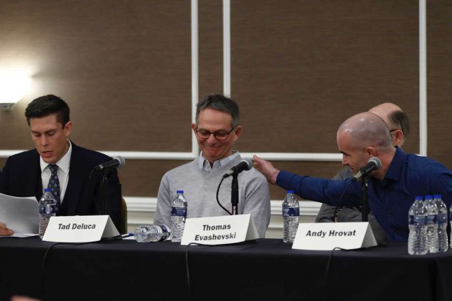 Tad Deluca, center, listens as attorney Parker Stinar addresses the media during a news conference, Thursday, Feb. 27, 2020 in Southfield, Mich. Deluca, a University of Michigan wrestler from the 1970s says he ... more