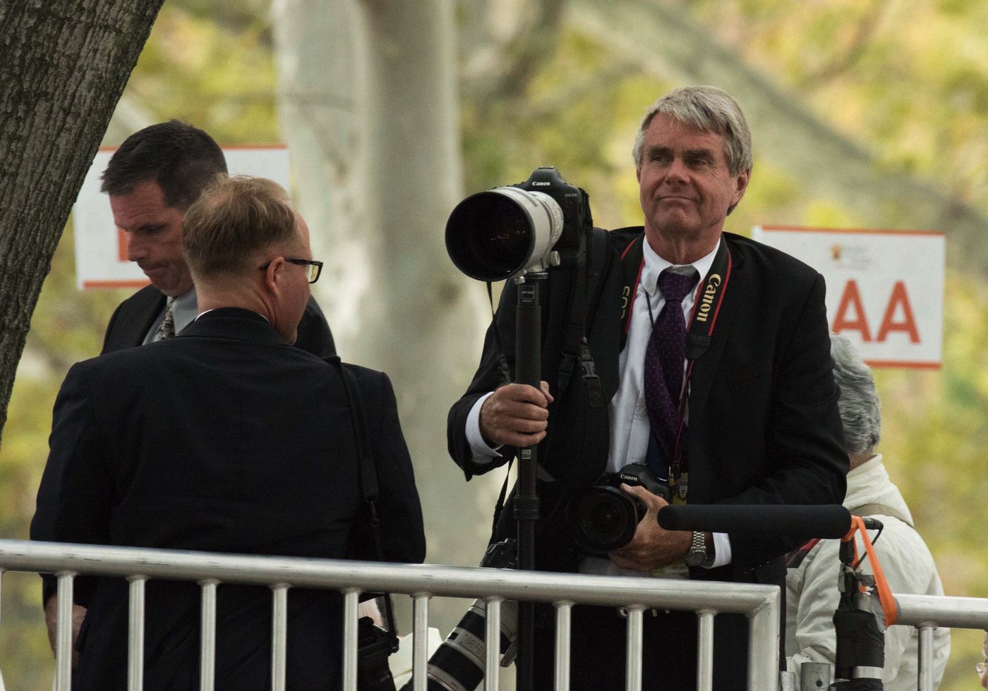 Inquirer staff photographer Michael Bryant waits for the Pope to arrive on the Benjamin Franklin Parkway to celebrate Mass on Sept. 27, 2015.