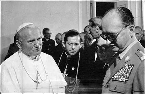 St. John Paul II meets Poland's Communist-era premiere, Wojciech Jaruzelski, in 1983. (Credit: Stock image.)