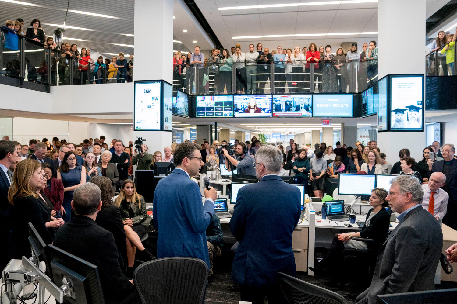 Chosen as Harvard’s principal speaker for the Class of 2020, Martin Baron’s many contributions to journalism are expounded upon by former colleagues. In April 2018, Baron (far right) in The Washington Post newsroom following the announcement of its two Pulitzer Prizes.