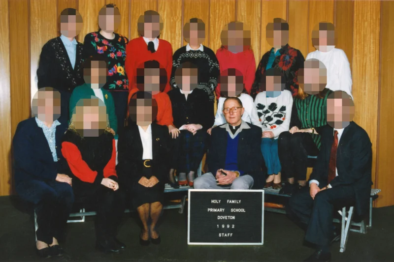Father Searson with staff at Holy Family in 1992