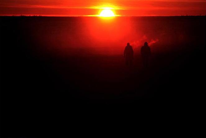 Couple walking to a potlach in Kotlik AK, February 2005. Photo by Damon Winter.