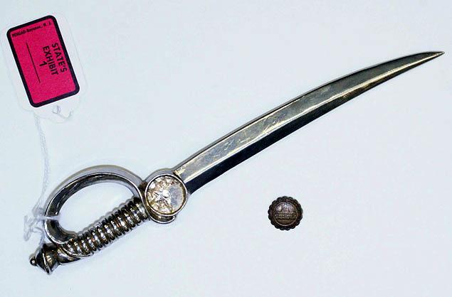 The weapon in the murder of sister Margaret Ann Pahl is a letter opener belonging to Rev. Gerald Robinson. The round object is a medallion that has been taken off the letter opener.