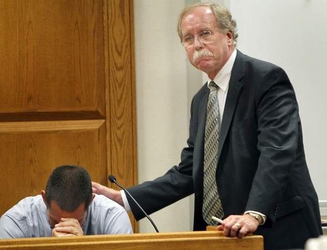 Troy Merryfield, is consoled by Attorney John Peterson after giving emotional testimony at the Outagamie County Justice Center in Appleton in May 2012. Outagamie County Judge Nancy Krueger dismissed the case on Monday, based on the agreement reached by the diocese and Todd and Troy Merryfield. No information was immediately available on the terms of the settlement. / File/Gannett Wisconsin Media