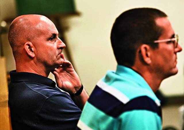 Todd Merryfield, left, and his brother Troy Merryfield listen to testimony in Appleton in May 2012. The Catholic Diocese of Green Bay will pay $700,000 to settle a civil lawsuit brought by the brothers stemming from a sex abuse case involving a former priest in the diocese. / File/Gannett Wisconsin Media