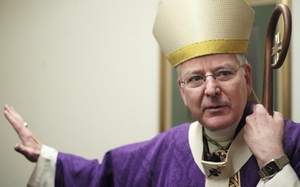 Archbishop John Nienstedt talks to the news media in Edina, Minn., Sunday. He asked for forgiveness for overlooking abuse cases. / AP
