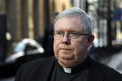 FILE - In this March 27, 2012 file photo, Monsignor William Lynn leaves the Criminal Justice Center in Philadelphia. Lynn, a Roman Catholic church official, who has been jailed for more than a year for his handling of priest sex-abuse complaints, had his conviction reversed and was ordered released Thursday Dec. 26, 2013. In dismissing the landmark criminal case, a three-judge Superior Court panel unanimously rejected prosecutors' arguments that Monsignor Lynn, the first U.S. church official ever charged or convicted for the handling of clergy-abuse complaints, supervised the welfare of any particular child.