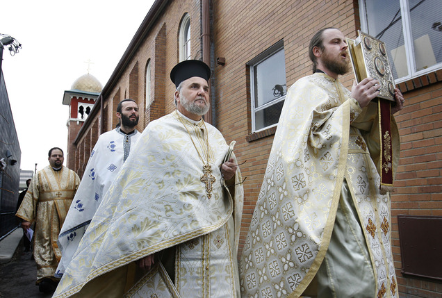(Scott Sommerdorf | Tribune file photo) Father Justin Havens (far right), of Saints Peter and Paul Orthodox Christian Antiochian Church, has agreed to help with priestly services while three Greek Orthodox priests in the Salt Lake City area have been ordered to suspend their priestly ministries due to a pay cut. This 2010 photo shows Rev. Michael Kouremetis, one of those three priests, following behind Havens.