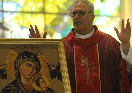 Rev. Eric Swearingen, pastor of the Catholic Church of Visalia, gives a homily during the Feast of Our Lady of Perpetual Help June 28, 2014, at St. Mary's Catholic Church. He is the new pastor of the Catholic Church of Visalia. (Photo: Teresa Douglass )