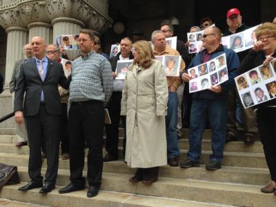 Alleged victims of child abuse by Milwaukee archdiocese priests stand on the steps of a federal bankruptcy court. (AP)