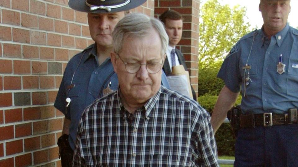 TIME SERVED: Ronald H. Paquin is shown under escort of Massachusetts state troopers. The ex-priest will be released after it was determined he is no longer dangerous.