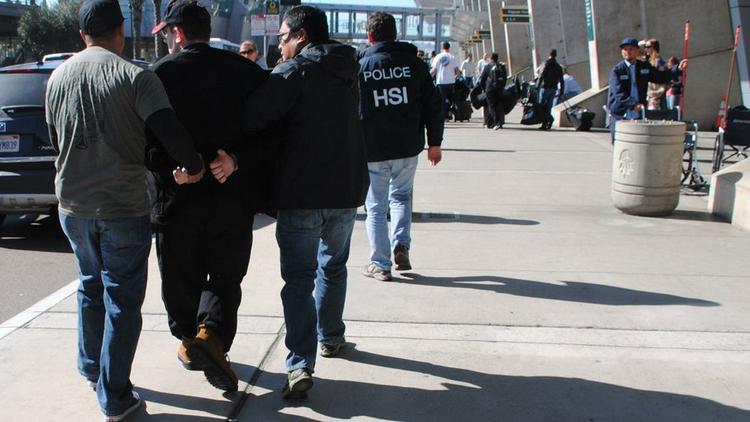 U.S. Homeland Security Investigations agents arrest Joel Wright at Lindbergh Field in San Diego on Jan. 29, 2016. He pleaded guilty to seeking to have sex with infants and young girls in Mexico. (U.S. Homeland Security Investigations)