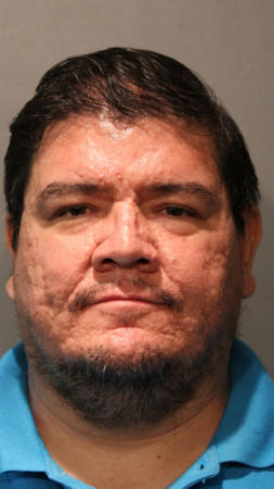 Octavio Munoz, 40, a priest who was removed from ministry in July, was charged Sept. 21, 2016, with possession of child pornography. (Chicago Police Department)
