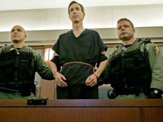 Warren Jeffs stands flanked by two Las Vegas Police officers at the Regional Justice Center in Las Vegas in this Spectrum Media file photo. (Photo: The Spectrum & Daily News file photo)