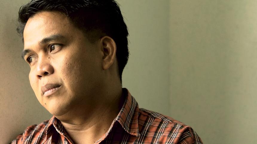 Father Fernando Sayasaya teaches Beginning English Grammar to teenagers during summer session at De La Salle University in Manila, Philippines. He is a fugitive with a rape case pending involving a young boy. File photo