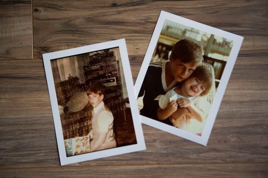 Photos of John Delaney as a child lie on the living room floor in his Sevierville, Tenn., home Thursday, Aug. 30, 2018, as he speaks about his experience being abused by the priest at his childhood church in Philadelphia. (Photo: Caitie McMekin/News Sentinel, )