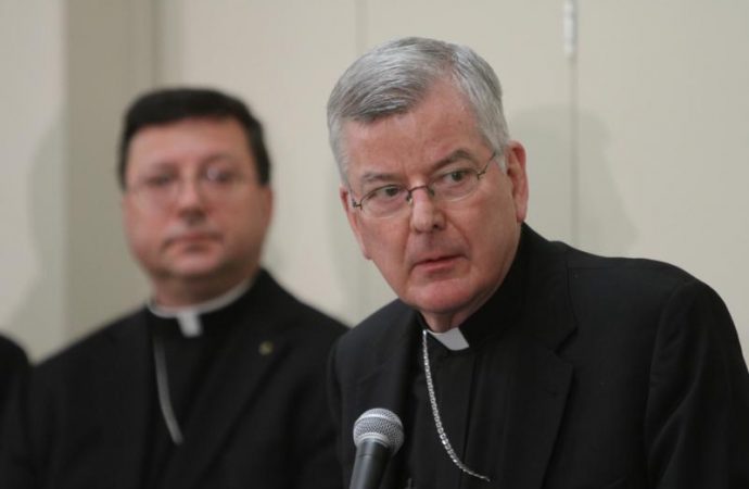Then-Archbishop John C. Nienstedt, right, addresses the media alongside then-Auxiliary Bishop Lee A. Piche at a 2015 news conference. (Credit: Dave Hrbacek/The Catholic Spirit via CNS.)