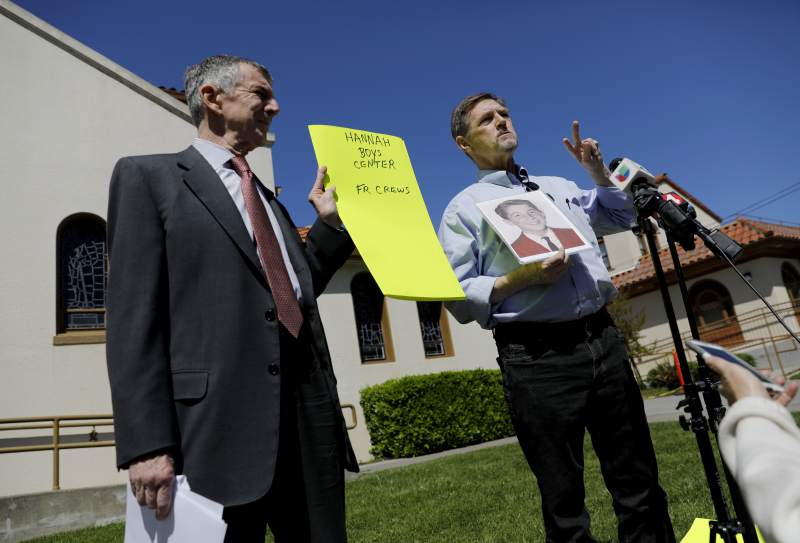 Attorney Joe George, left, and David Clohessy, the Missouri director of SNAP, speak about allegations of sexual abuse from two men against Rev. John Crews, a Catholic priest who is the former executive director of the Hanna Boys Center. Photo taken during a press conference outside St. Frances Solano Catholic Church in Sonoma, California on Wednesday, April 17, 2019. (BETH SCHLANKER/The Press Democrat)