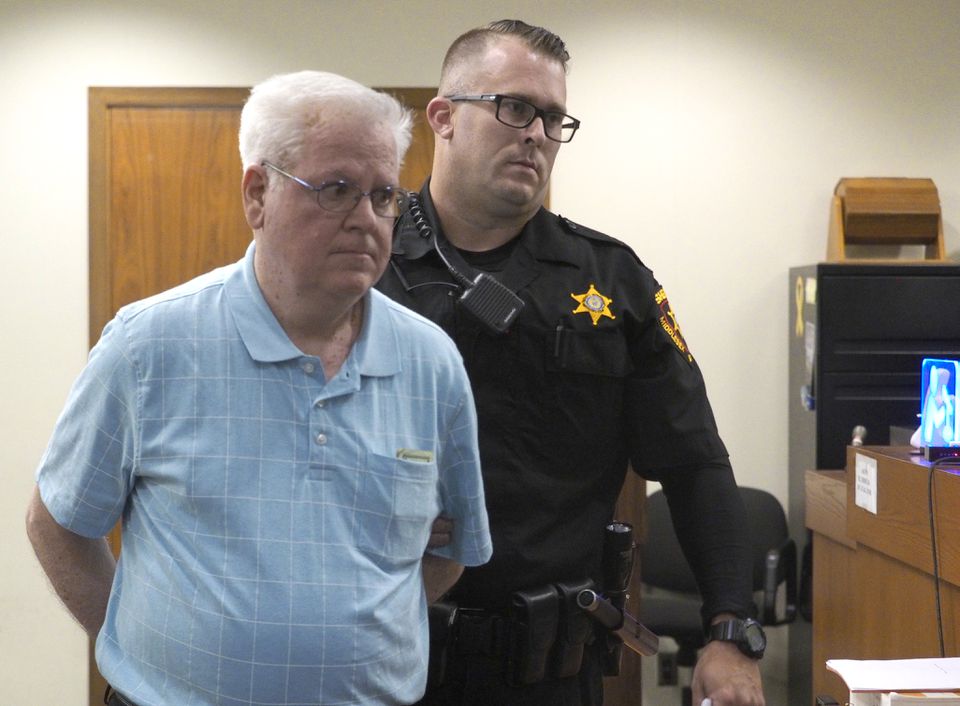 Fr. Thomas Ganley who pleaded guilty in April to sexually assaulting a teenage girl 30 years ago was sentenced to four years in prison. He is escorted out of the courtroom in handcuffs after being sentenced by Middlesex County Superior Court Judge Diane Pincus in New Brunswick. August 26, 2019 (Patti Sapone | NJ Advance Media for NJ.com)