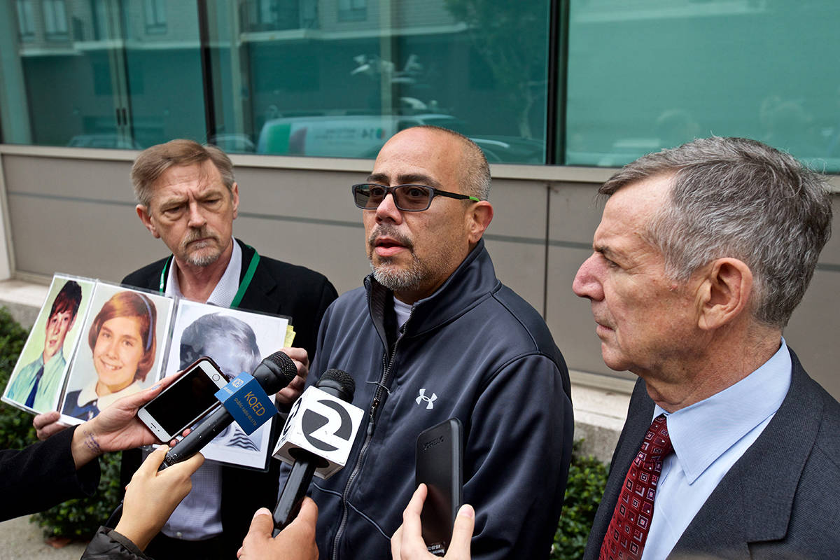 Genaro Licea, center, announced a new clergy abuse lawsuit Thursday against the Archdiocese of San Francisco alongside his attorney Joseph George, right, outside the diocese’s headquarters. (Kevin N. Hume/S.F. Examiner)