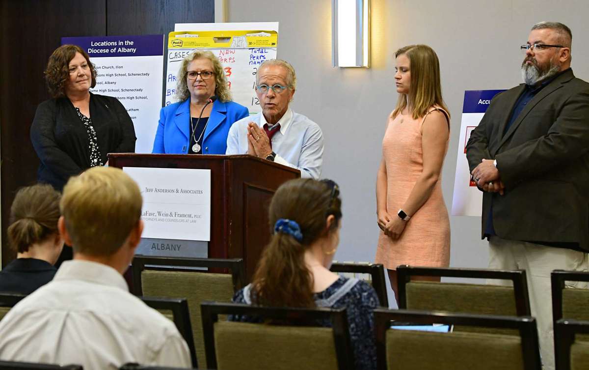 Attorney Jeff Anderson, center, announces 20 lawsuits filed against the Albany Diocese on the first day the Child Victims Act at the Hilton Albany on Wednesday, Aug. 14, 2019 in Albany, N.Y. Survivor Jeanne Marron, left, attorney Cynthia LaFave, second from left, and survivors Bridie Farrell and Mark Lyman stand at right. The act allows a one-year period for claims to be filed regardless of the age of the plaintiff. (Lori Van Buren/Times Union)Lori Van Buren/Albany Times Union