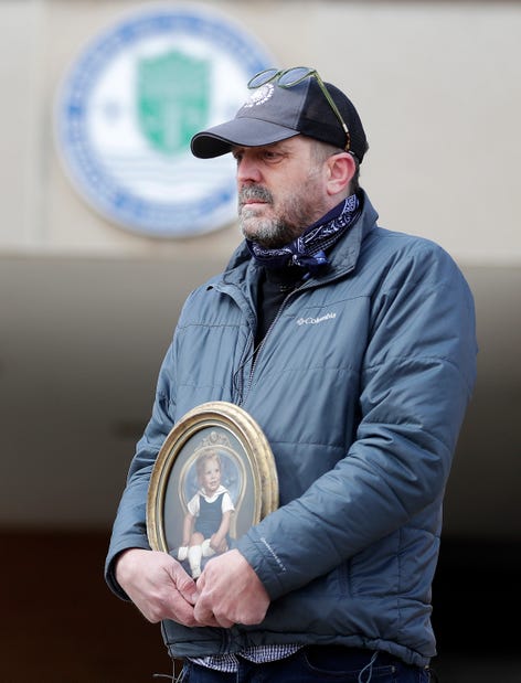 Aaron Lindstrom, whose brother, Nate, died by suicide at age 45 after suffering from clergy abuse as a child, participates in a memorial rally held outside Green Bay Notre Dame on March 7, 2021, in Green Bay, Wis. Sarah Kloepping/USA TODAY NETWORK-Wisconsin