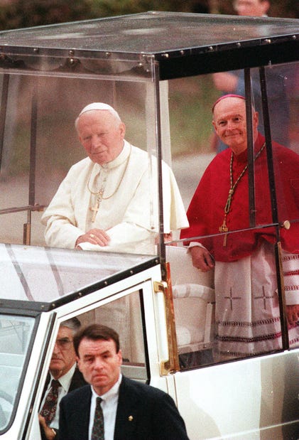 Newark Archbishop Theodore McCarrick rides in the popemobile alongside Pope John Paul II during his visit to Newark on Oct. 4, 1995. Joe McLaughlin/THN