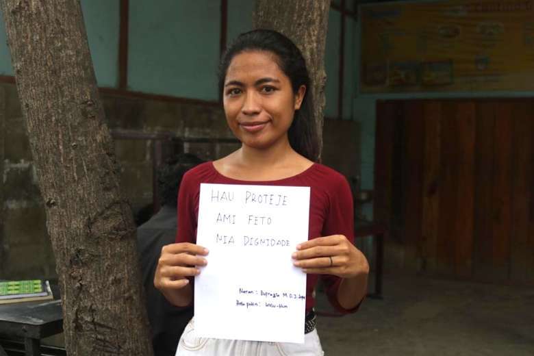 A woman shows her support for efforts to fight sexual abuse in Timor-Leste. (Photo supplied)