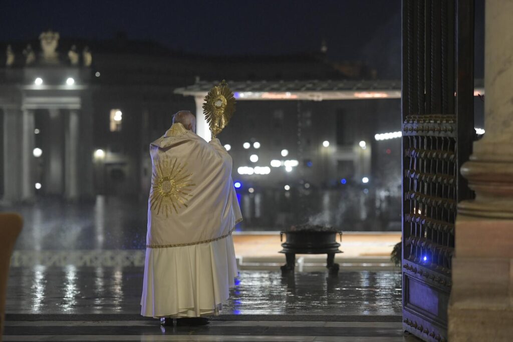 Pope Francis holds the monstrance as he delivers his extraordinary blessing “urbi et orbi” (to the city and the world) during a prayer service in the portico of St. Peter’s Basilica at the Vatican March 27, 2020. (CNS photo/Vatican Media)