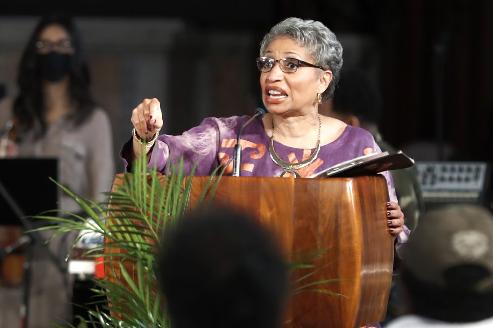 Associate Minister of St. Sabina Catholic Church Kimberly Lymore, addresses the congregation during a Sunday church service at St. Sabina Catholic Church in the Auburn Gresham neighborhood in Chicago, Sunday, March 7, 2021. (AP Photo/Shafkat Anowar)