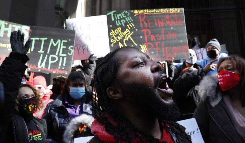 Joseph Saunders and other members of Chicago's St. Sabina Catholic Church rally outside the Archdiocesan Pastoral Center in Chicago demanding resolution of the investigation into allegations against the Rev. Michael Pfleger on Wednesday, Feb 24, 2021 in Chicago.