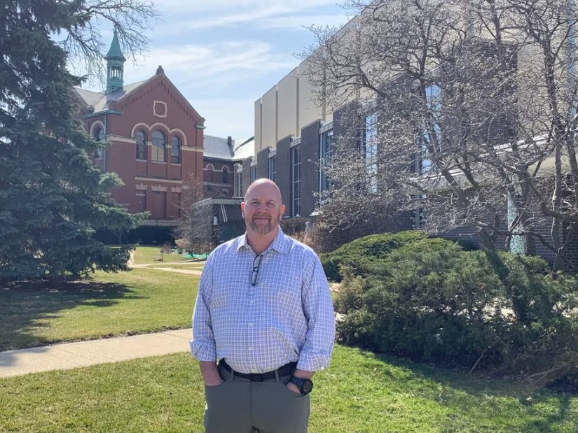 Timothy Nockels, who says he was molested as a boy by the Rev. John Baptist Ormechea when the priest was assigned to Immaculate Conception parish. The Norwood Park church and the former Passionist monastery are in the background. Robert Herguth / Sun-Times