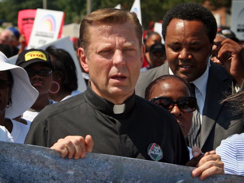 Two men who say St. Sabina's activist priest, the Rev. Michael Pfleger, of sexual abuse in the 1970s have taken lie-detector tests in hopes of strengthening their accusations. (Scott Olson/Getty Images)