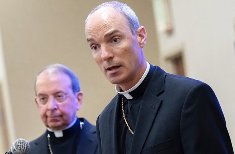 Bishop Adam J. Parker and Archbishop William E. Lori are shown addressing the media in a 2019 file photo. (CR file)