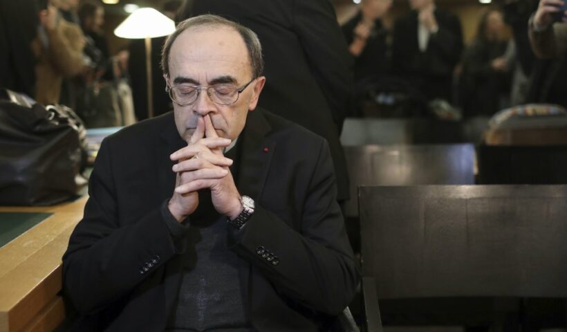 FILE - In this Jan. 7, 2019 file photo, French Cardinal Philippe Barbarin waits for the start of his trial at the Lyon courthouse, central France. France's highest court confirmed on Wednesday that the former archbishop of Lyon, Cardinal Philippe Barbarin, is not guilty of covering up the sexual crimes of a predator priest. (AP Photo/Laurent Cipriani, File)