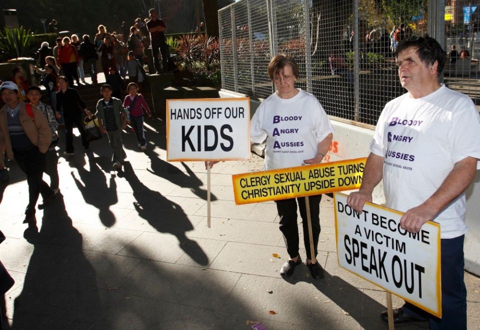 Carmel Rafferty and Ian Liwther protest clergy sexual abuse outside St. Mary's Cathedral in Sydney in this July 18, 2008, file photo. (CNS photo/Paul Haring)