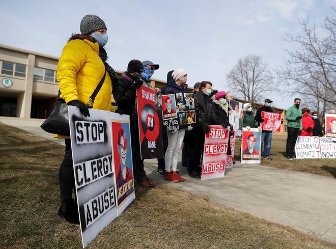 Family, friends and supporters of Nate Lindstrom, who died by suicide at age 45 after reporting he was sexually abused by priests as a child, participate in a memorial rally held outside Notre Dame Academy in Green Bay on March 7. Photo Sarah Kloepping / USA Today Network-Wisconsin