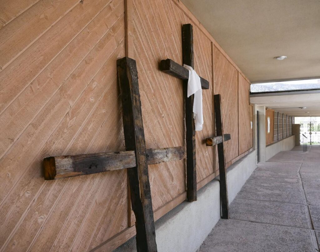 Three crosses are displayed along a walkway at Mary, Mother of Priests Catholic Church in Jemez Springs. Matt Dahlseid / The New Mexican