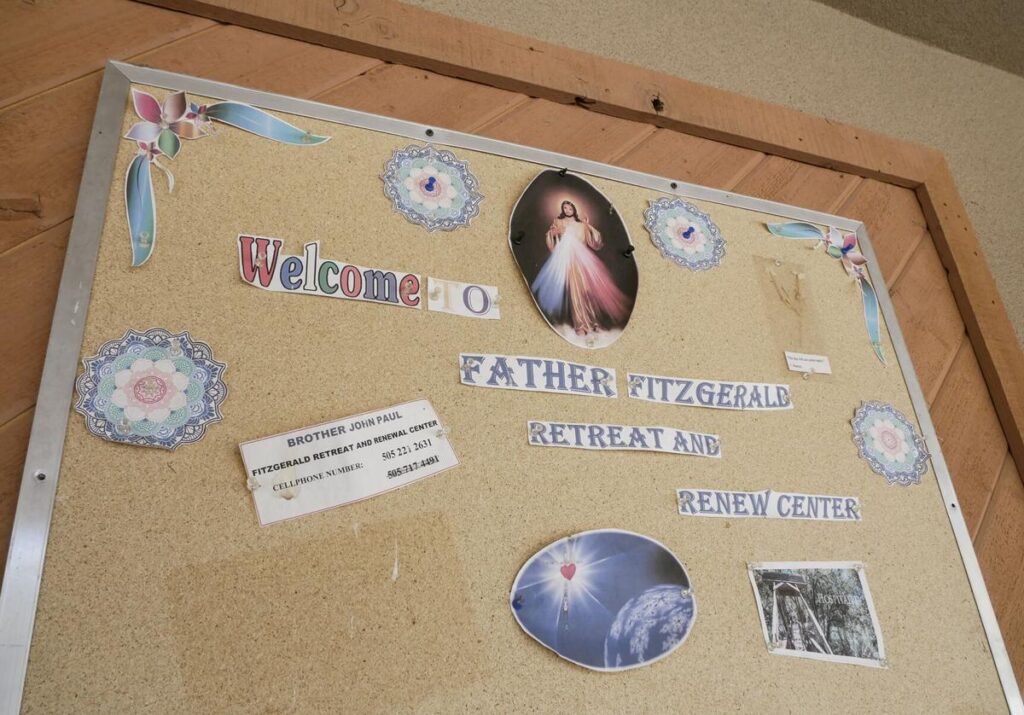 A corkboard with notes tacked to it says the possibility for retreat remains at the organization’s motel-like facility in Jemez Springs. Matt Dahlseid / The New Mexican