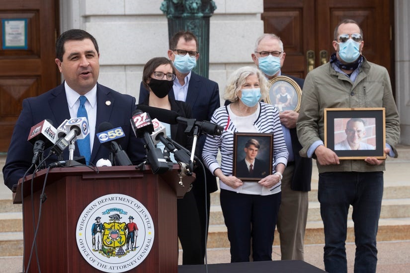 Attorney General Josh Kaul speaks Tuesday, April 27, 2021 at the state Capitol about a Wisconsin Department of Justice initiative to review clergy abuse cases. In the background is the family of Nate Lindstrom, who took his own life at age 45 last year. Lindstrom accused three priests at St. Norbert Abbey in De Pere of sexual abuse. MARK HOFFMAN / MILWAUKEE JOURNAL SENTINEL