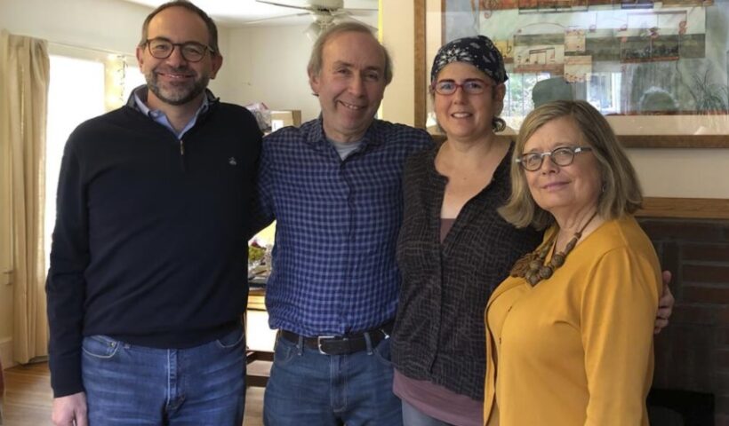 Associated Press Religion Writer Rachel Zoll, second from right, receives a visit in Amherst, Mass., on Oct. 26, 2018, from Managing Editor Brian J. Carovillano, editor at large Jerry Schwartz, and Deputy Managing Editor Sarah L. Nordgren after being awarded an Oliver S. Gramling Journalism Award for being AP's pre-eminent voice on religion for more than a decade. Zoll, who for 17 years as a religion writer for The Associated Press endeared herself to colleagues, competitors, and sources with her warm heart and world-class reporting skills, has died after a three-year bout with brain cancer. She was 55. (Cheryl Zoll via AP)